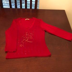Red woman’s quarter length sleeve shirt
